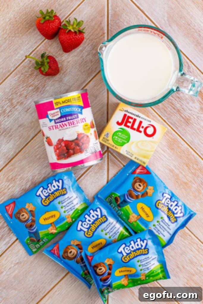 The Wandering Strawberry Cheesecake 4 Ingredients needed: instant cheesecake pudding, milk, honey teddy grahams, strawberry pie filling and sliced strawberries