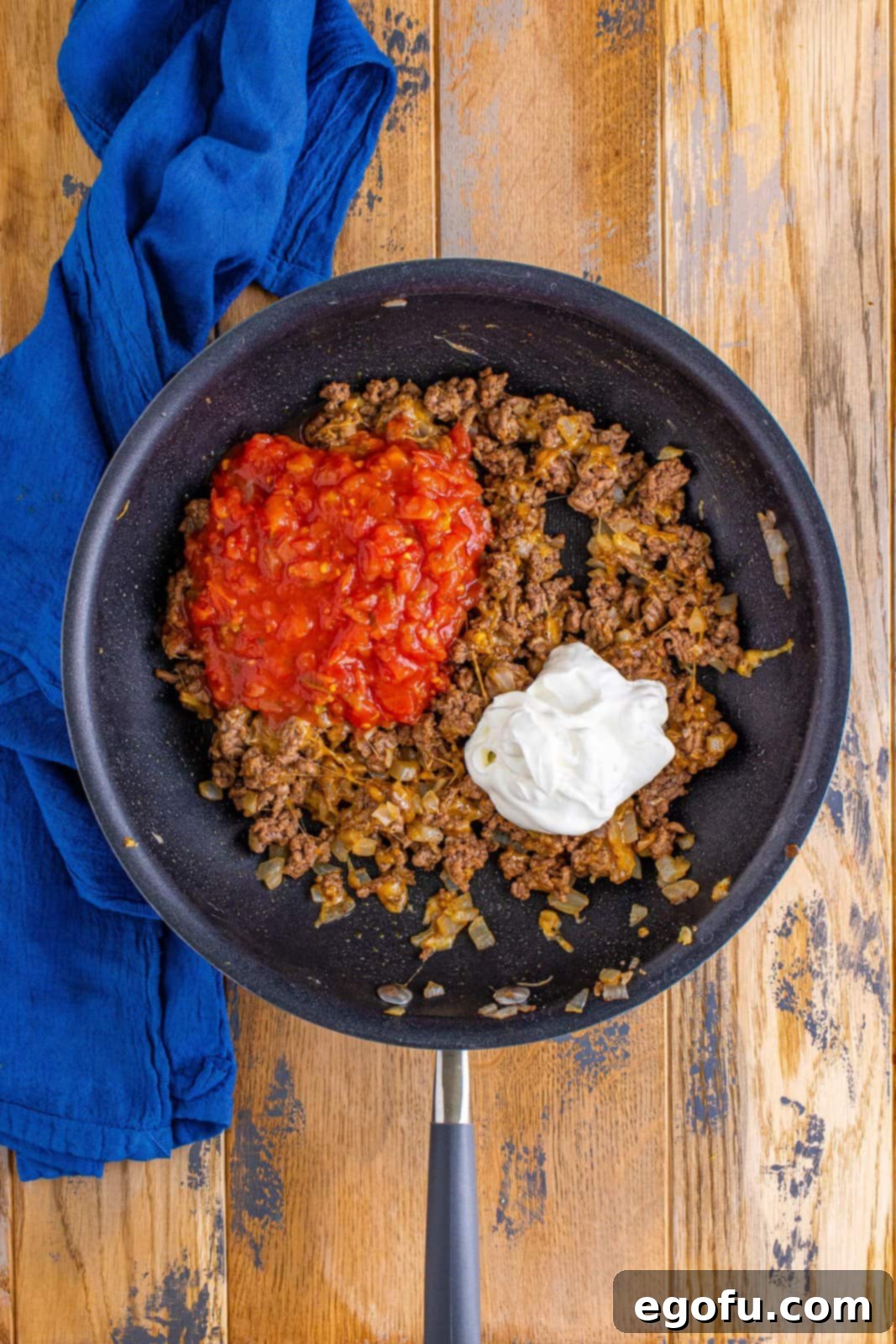 Effortless Taco Bake 9 sour cream and salsa added to beef mixture.