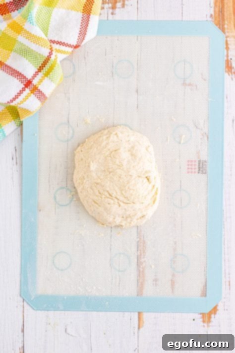 Dough on mat kneaded out and resting.