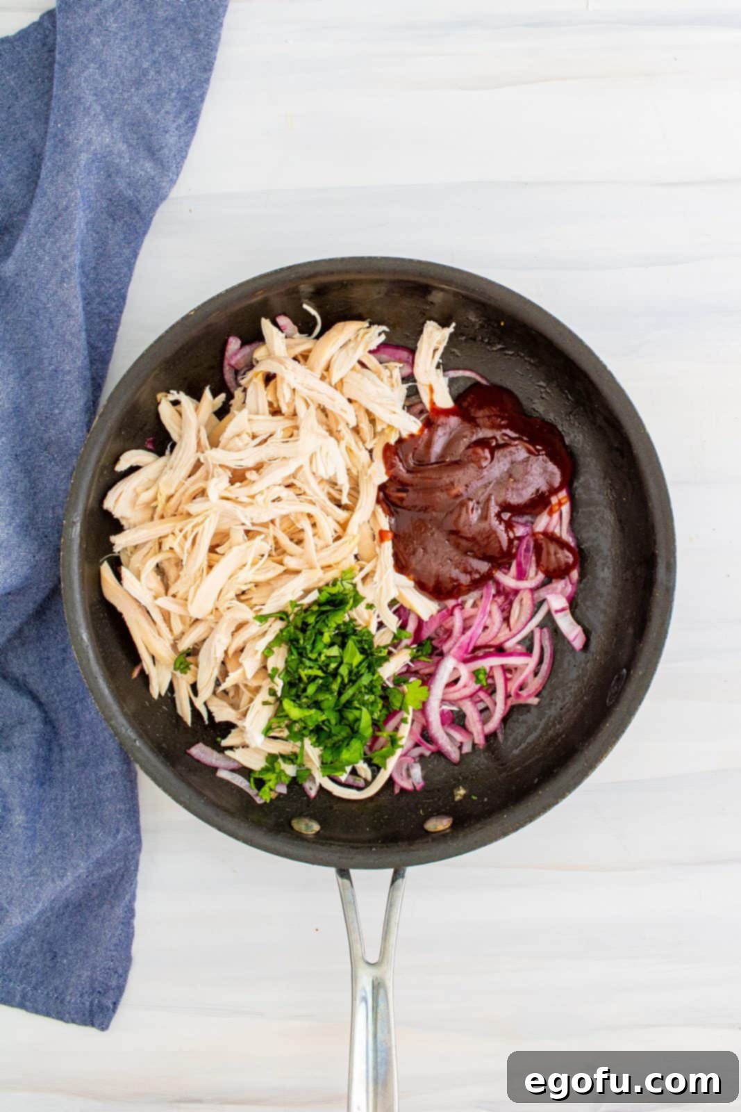 Smoky BBQ Chicken Pizza Bites 6 Chicken, bbq sauce and cilantro added to pan with onions.