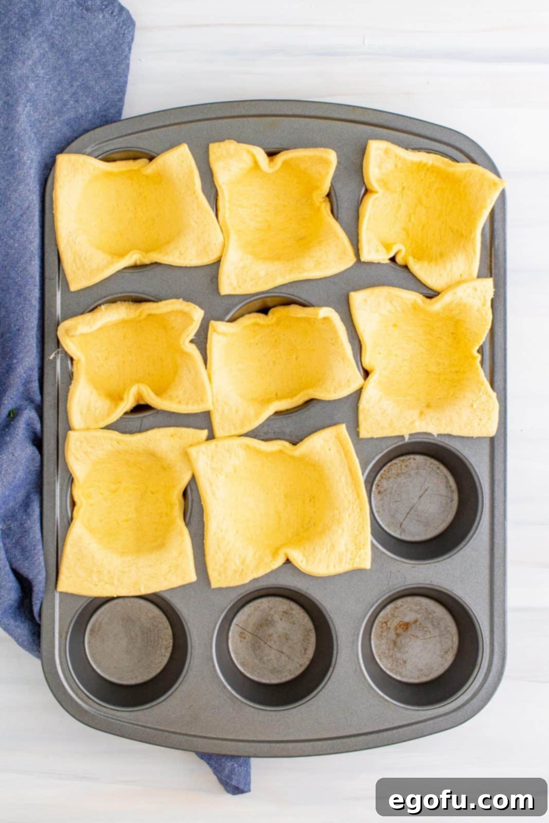 Smoky BBQ Chicken Pizza Bites 8 Crescent dough sheet cut and placed in bottom of greased muffin tin.