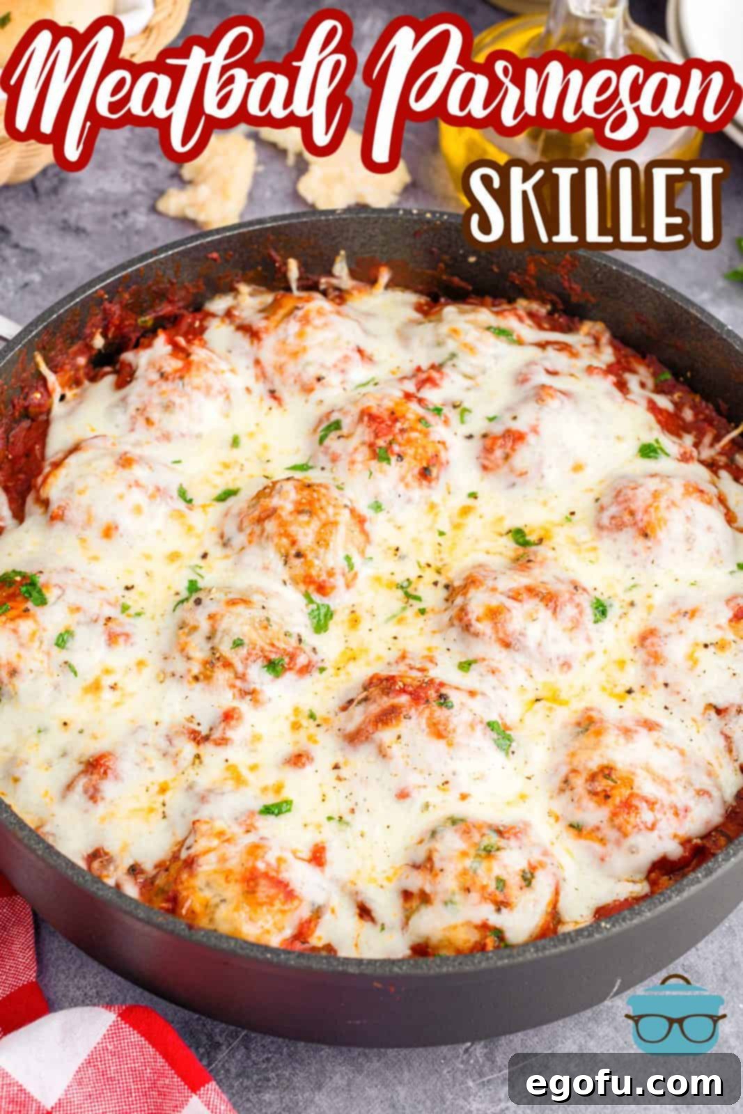 Easy Cheesy Skillet Meatballs 3 Meatball Parmesan Skillet in a rustic pan, garnished with fresh parsley.