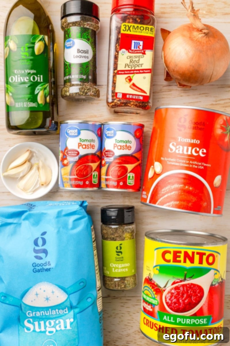 Olive oil, garlic, basil, tomato sauce, tomato paste, onion, crushed red pepper, crushed tomatoes, and oregano.