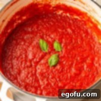 Looking down on a large pot of Homemade Marinara Sauce.