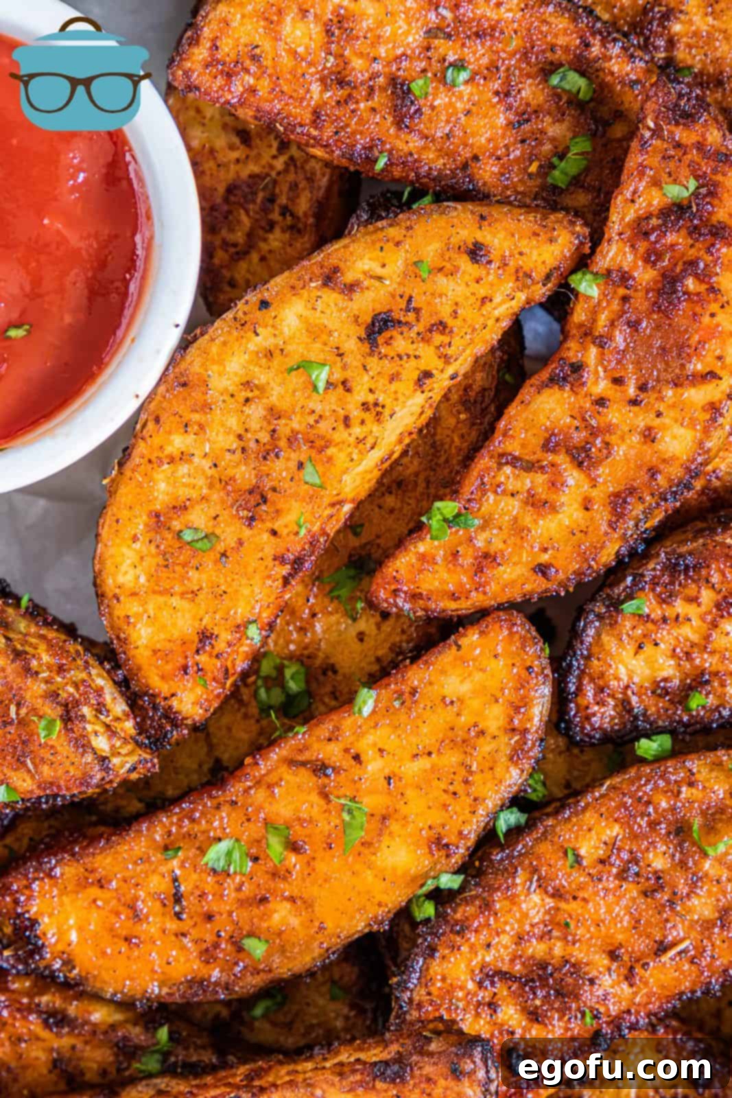 Close up of Air Fryer Potato Wedges garnished with parsley.