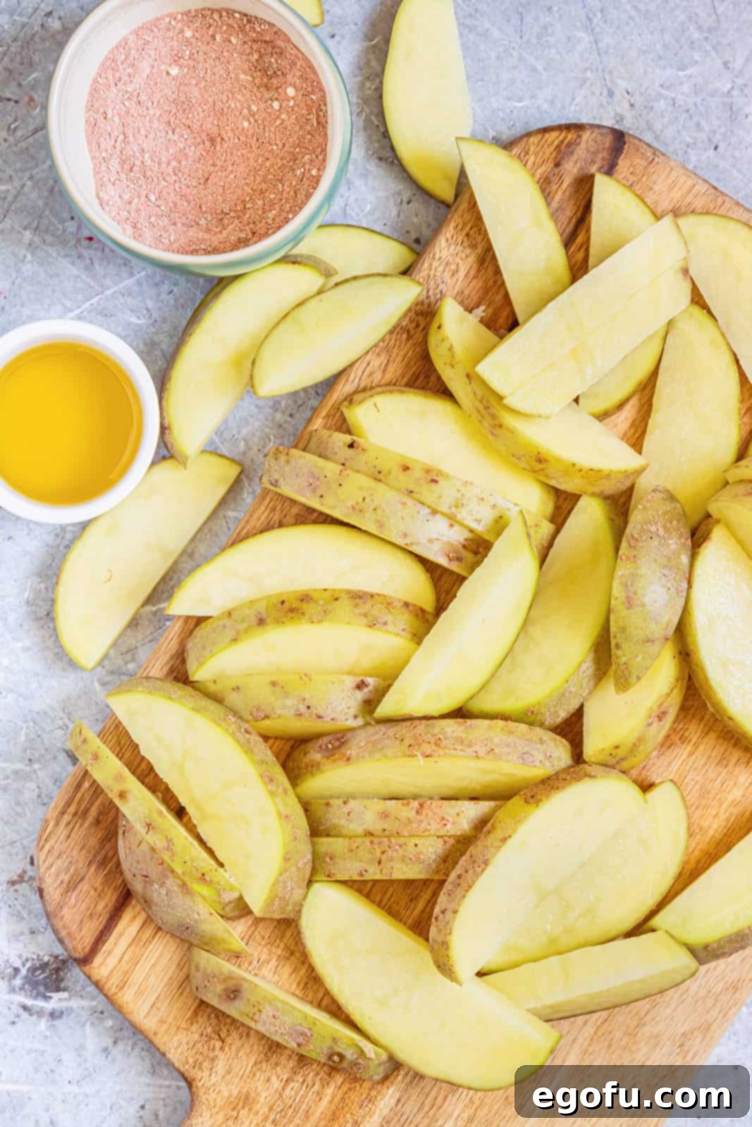 Cut up potatoes into wedges.