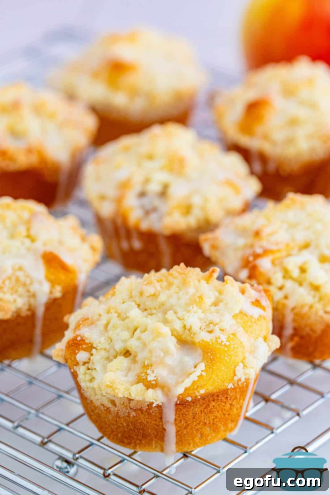Quick Apple Pie Bites 15 Easy Apple Pie Cups on a wire rack, allowing the glaze to set and the cups to cool further before serving.