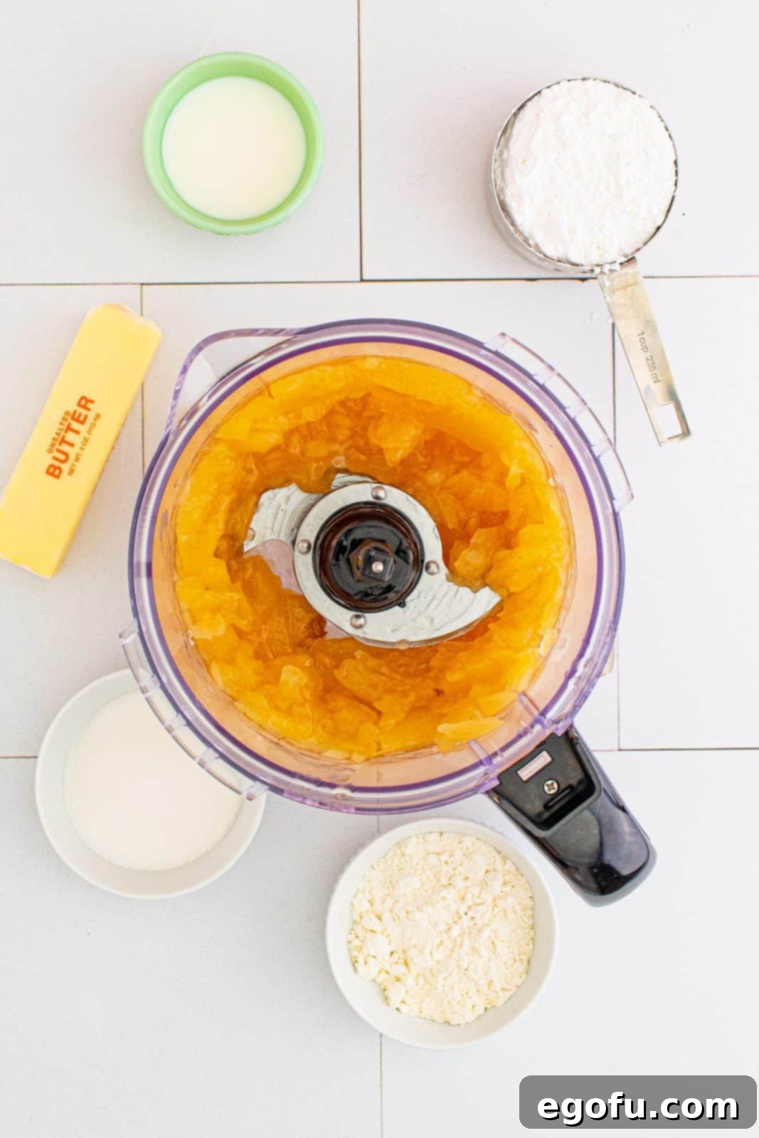 Quick Apple Pie Bites 6 Apple pie filling after being processed down in a food processor, showing smaller, evenly chopped apple pieces.