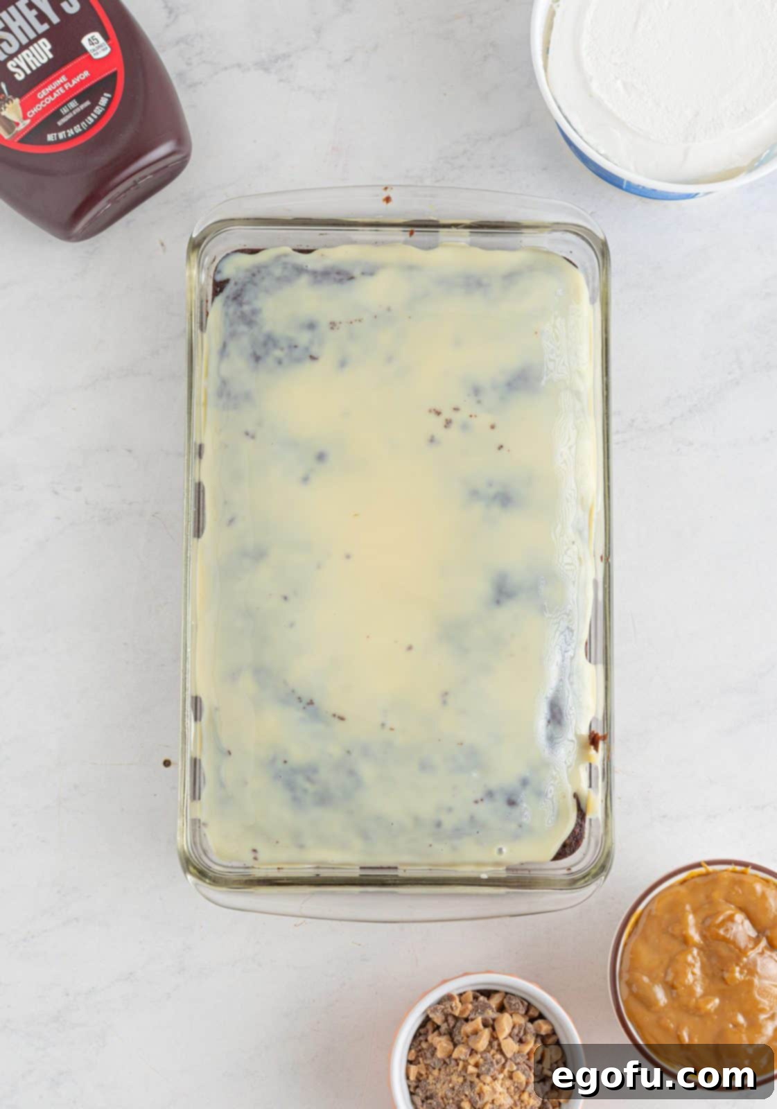 Pure Ecstasy Dessert 6 Sweetened condensed milk poured over cake.