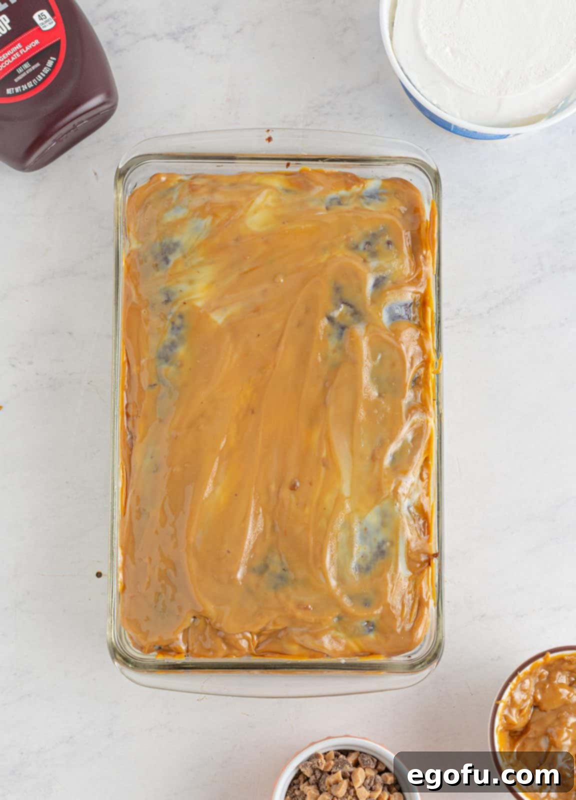 Pure Ecstasy Dessert 7 Dulce de leche spread over sweetened condensed milk on cake.