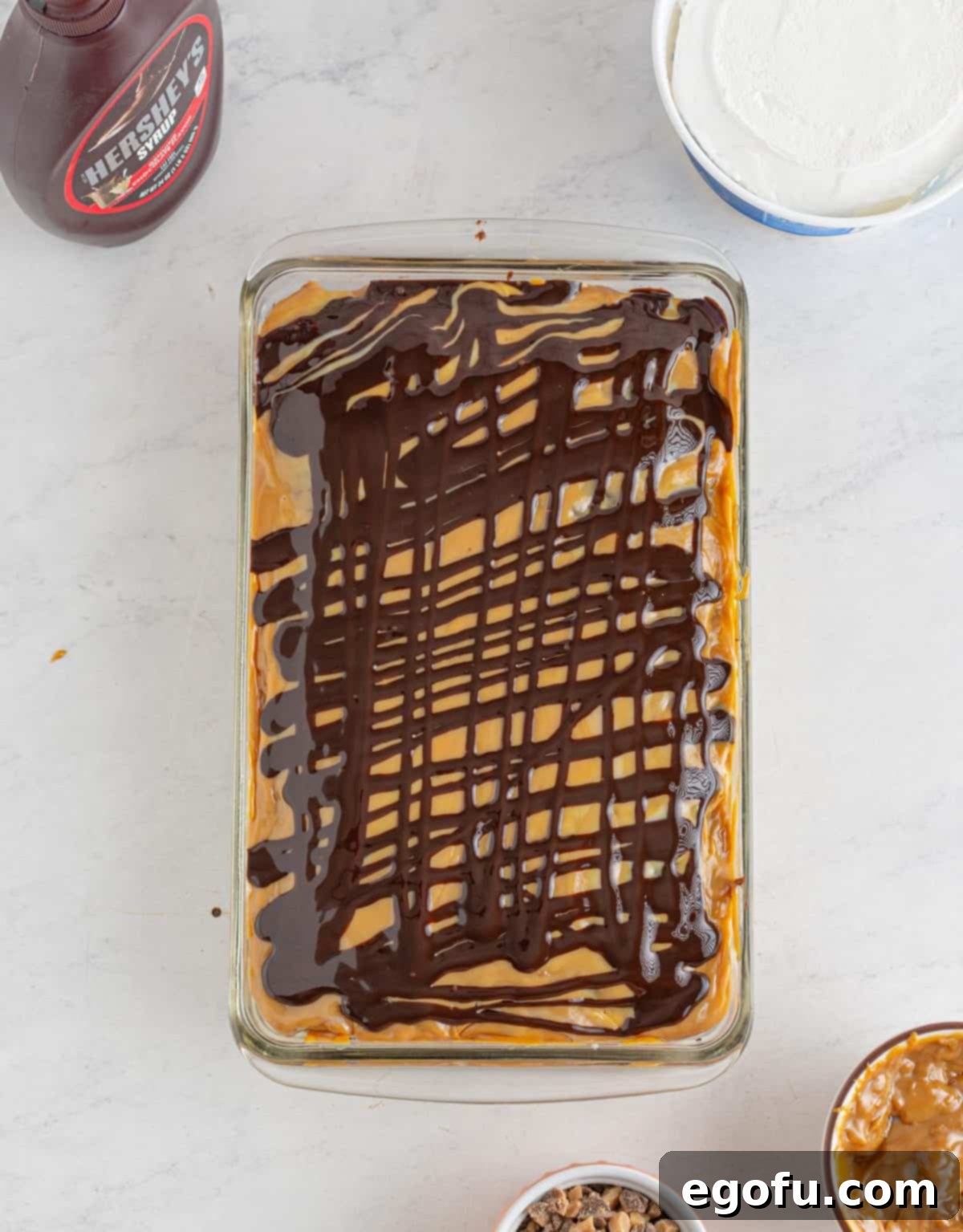 Pure Ecstasy Dessert 8 Chocolate drizzled over dulce de leche layer.