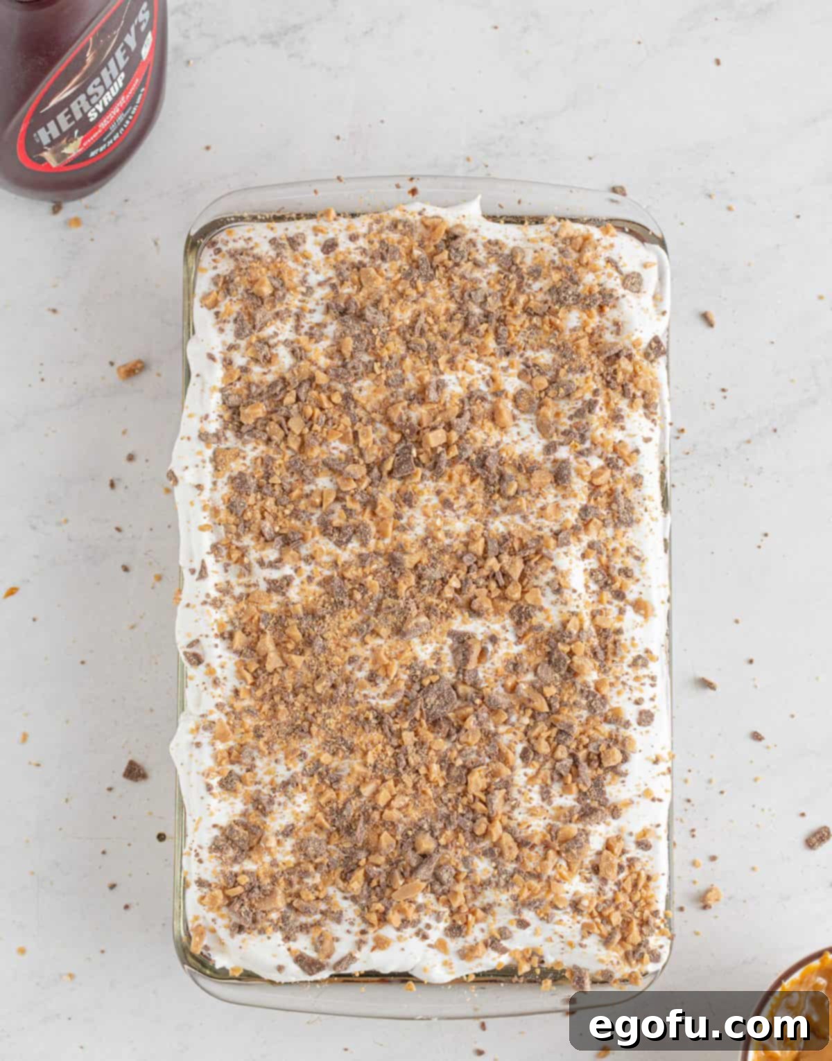 Pure Ecstasy Dessert 9 Cool whip and heath bits on top of cake.