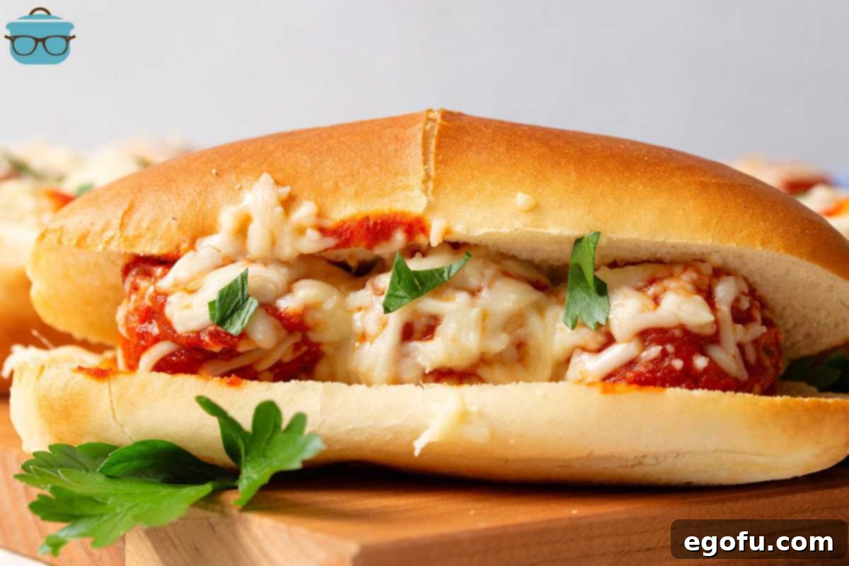 Finished Crock Pot Turkey Meatball Sub on wooden board.