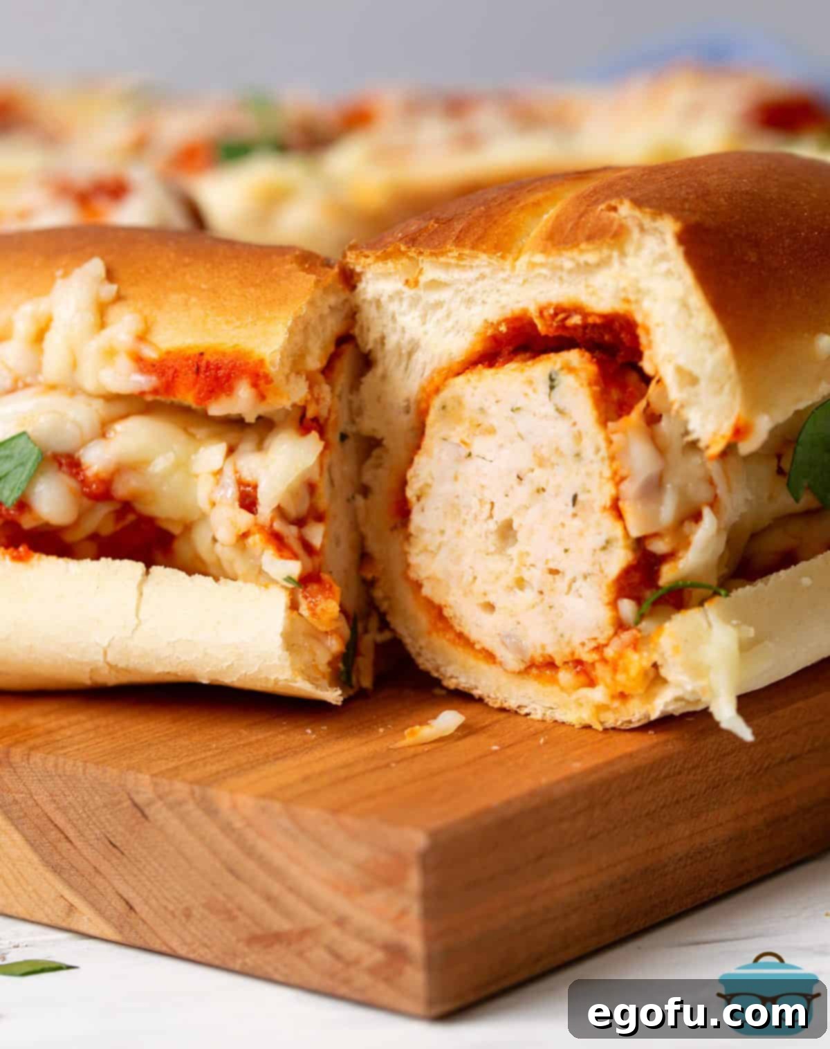 Crock Pot Turkey Meatball Sub split in half showing inside of meatball.