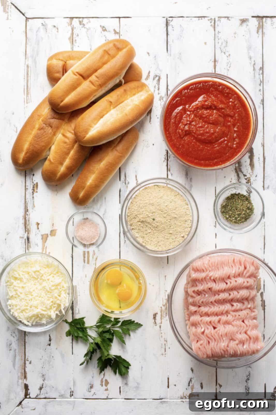 Ingredients needed: lean ground turkey, Italian bread crumbs eggs, italian seasoning, salt, marinara or pasta sauce, sub rolls, mozzarella cheese and fresh parsley.
