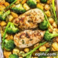 Garlic Butter Sheet Pan Chicken Dinner 14 Square image of Garlic Butter Chicken on pan out of oven.