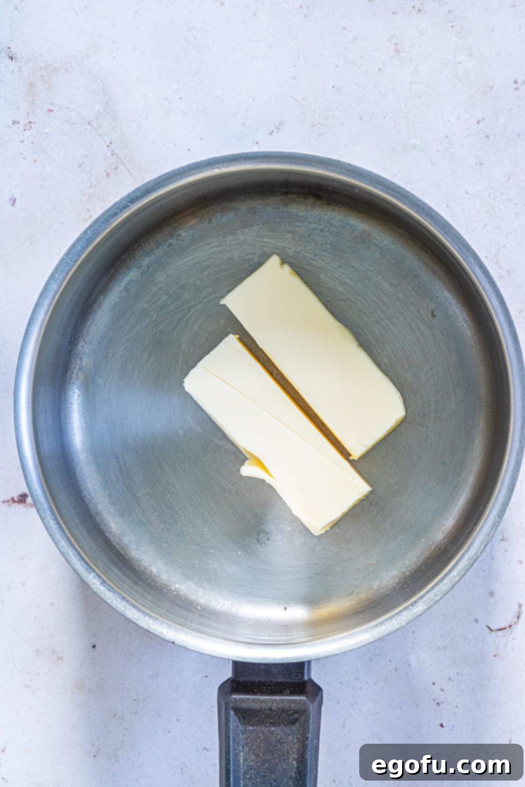 Garlic Butter Sheet Pan Chicken Dinner 6 Butter in pan.