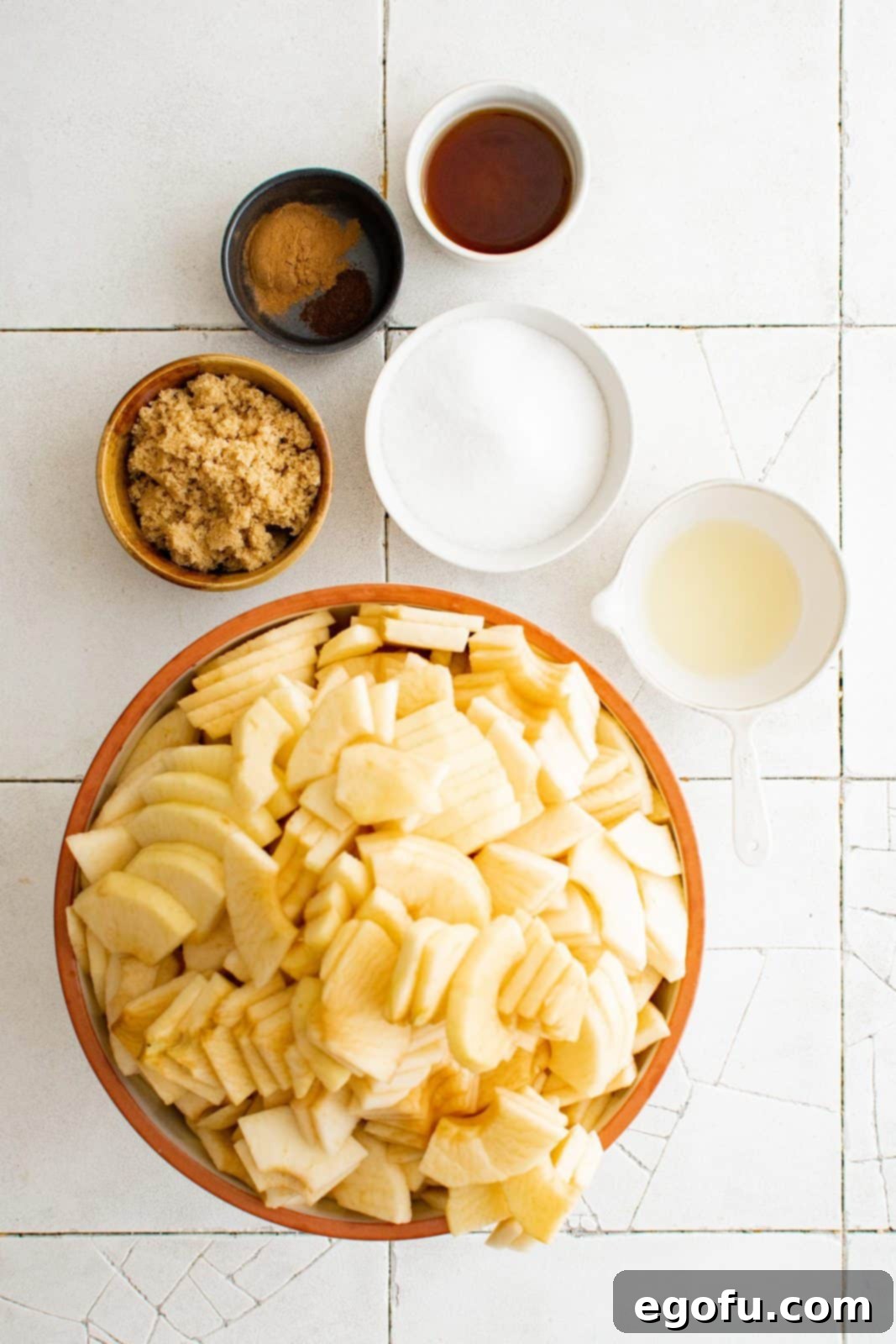 Ingredients needed: apples, granulated sugar, light brown sugar, lemon juice, vanilla extract, ground cinnamon and ground cloves.