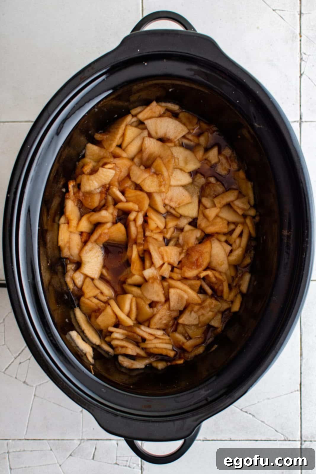 Finished cooked apple mixture in slow cooker.