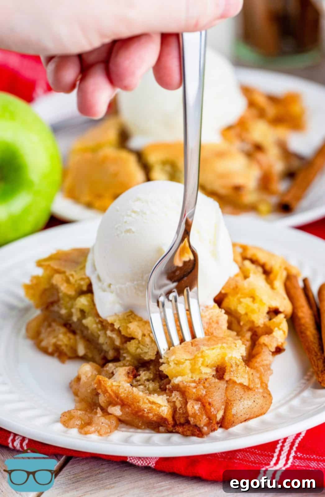 Grammies Homestyle Swedish Apple Pie 2 Piece of Grammie's Swedish Apple Pie on plate with ice cream and fork poking into slice.