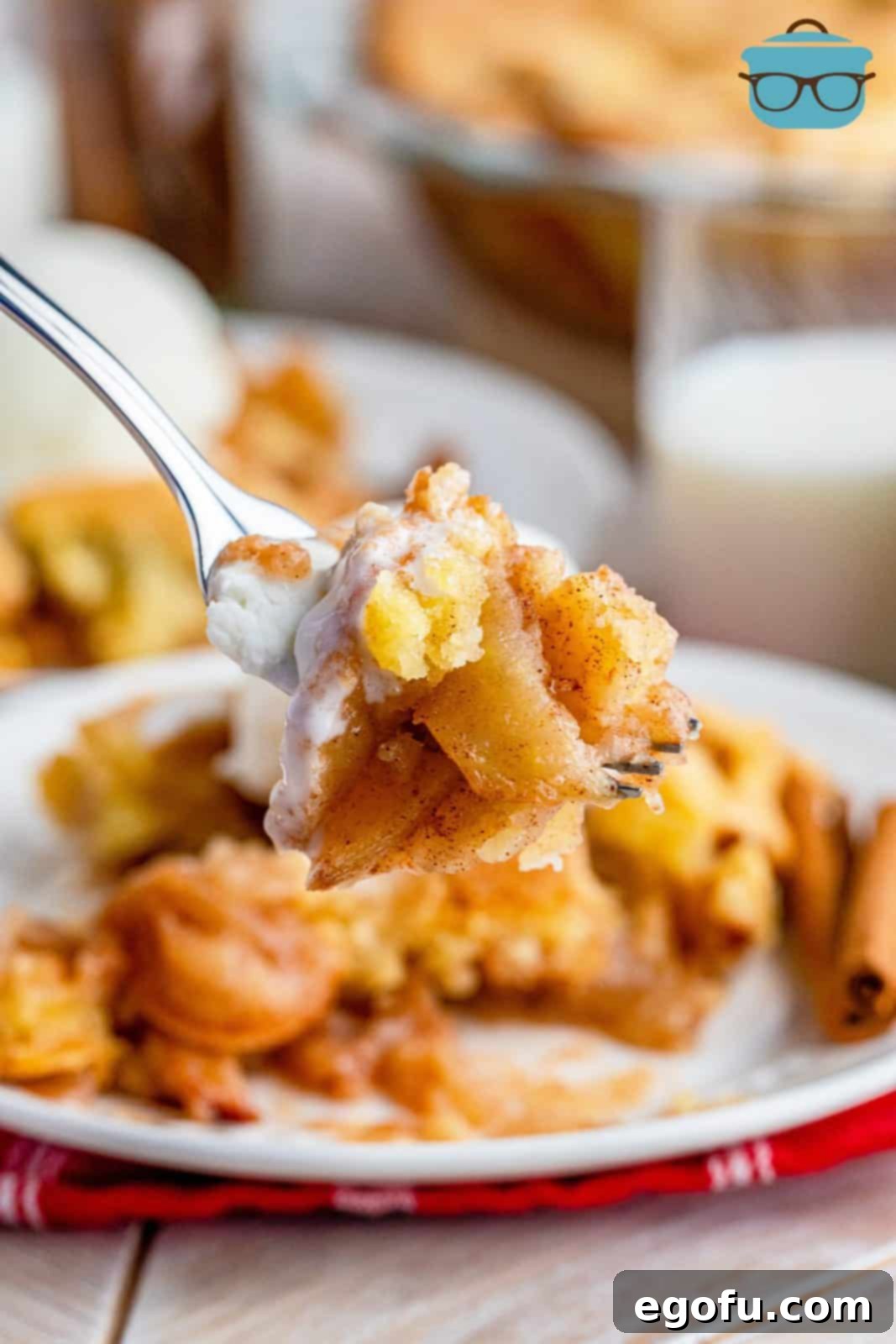 Grammies Homestyle Swedish Apple Pie 14 Fork holding up bite taken out of pie.