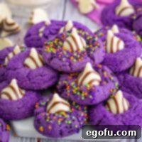 Square image of finished Halloween Witch Hat Cookies stacked on platter, a perfect thumbnail.