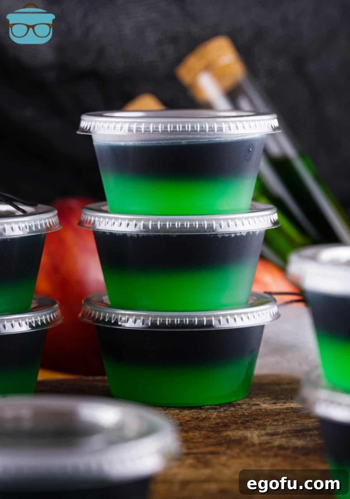 Three stacked Halloween Poison Apple Jell-O Shots