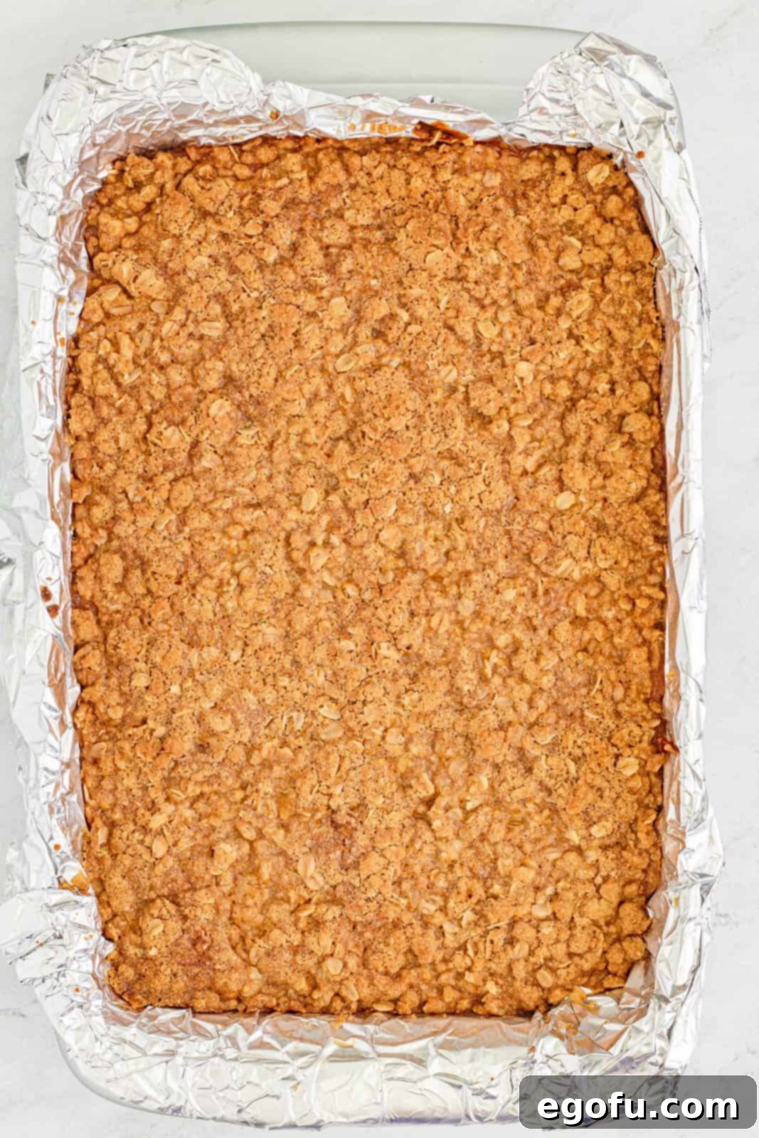 Finished baked Pumpkin Streusel Bars in the baking pan, showing the golden-brown streusel topping.