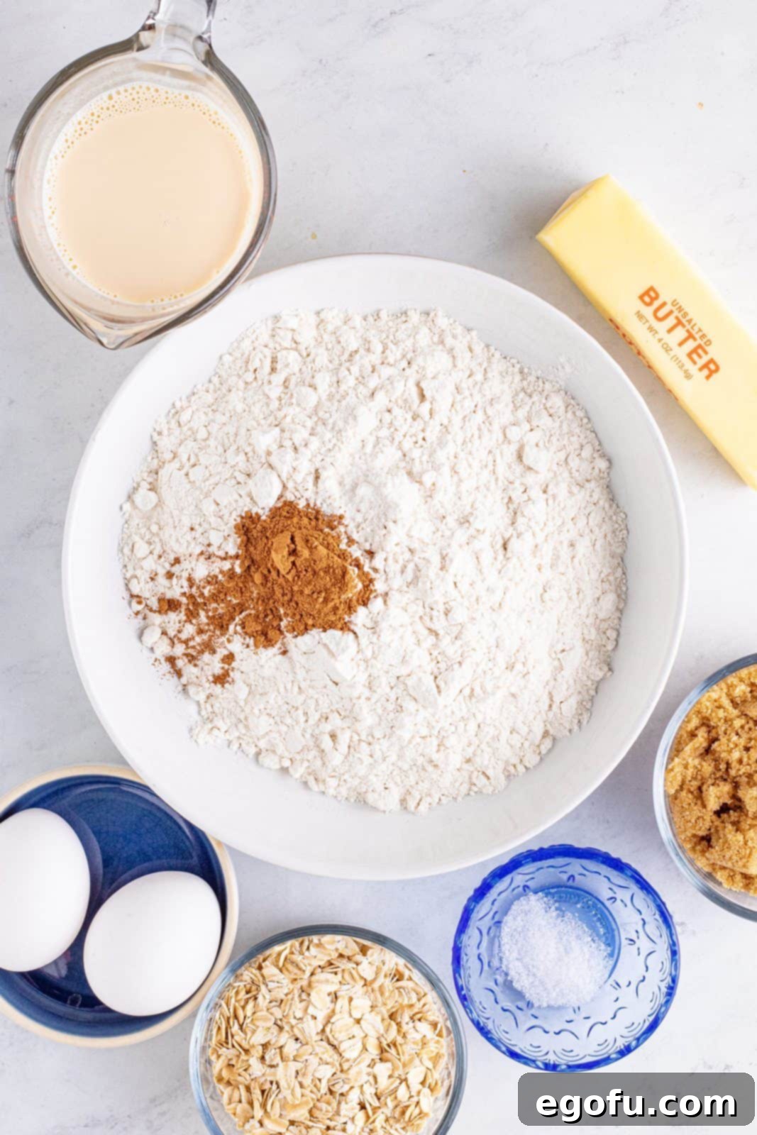 Dry ingredients for the crust in a white bowl, ready to be mixed.