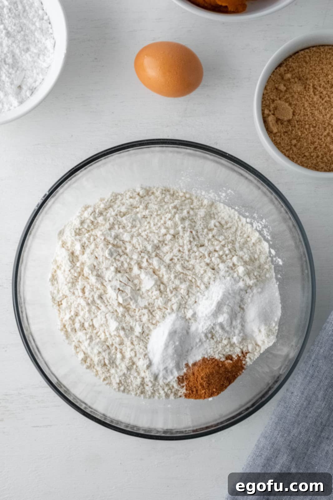 Fall Pumpkin Crinkle Delights 5 Dry ingredients in clear bowl, ready to be mixed.