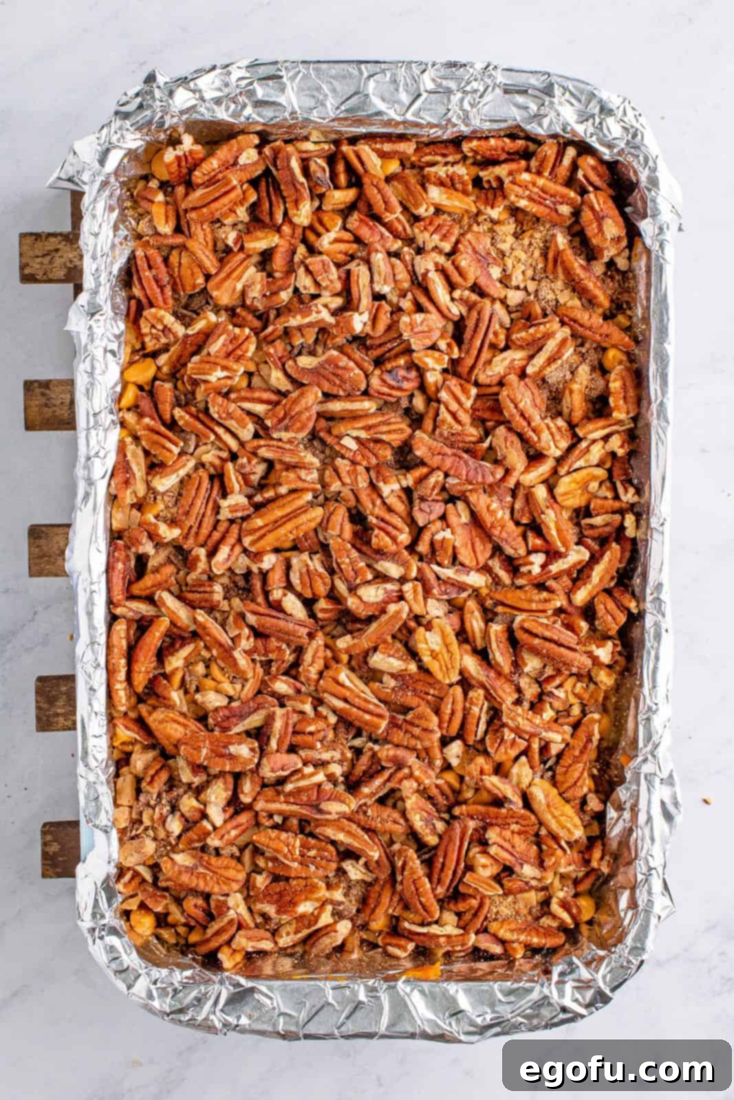 Autumn Magic Pumpkin Bars 9 Layers of butterscotch chips, toffee bits, and pecans added on top of the pumpkin pie filling, creating a rich topping.