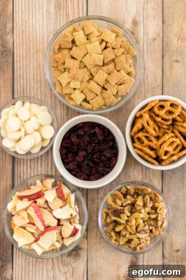 Ingredients needed: cinnamon chex mix, mini pretzels, dried apple chips, walnuts, dried cranberries and white chocolate chips.