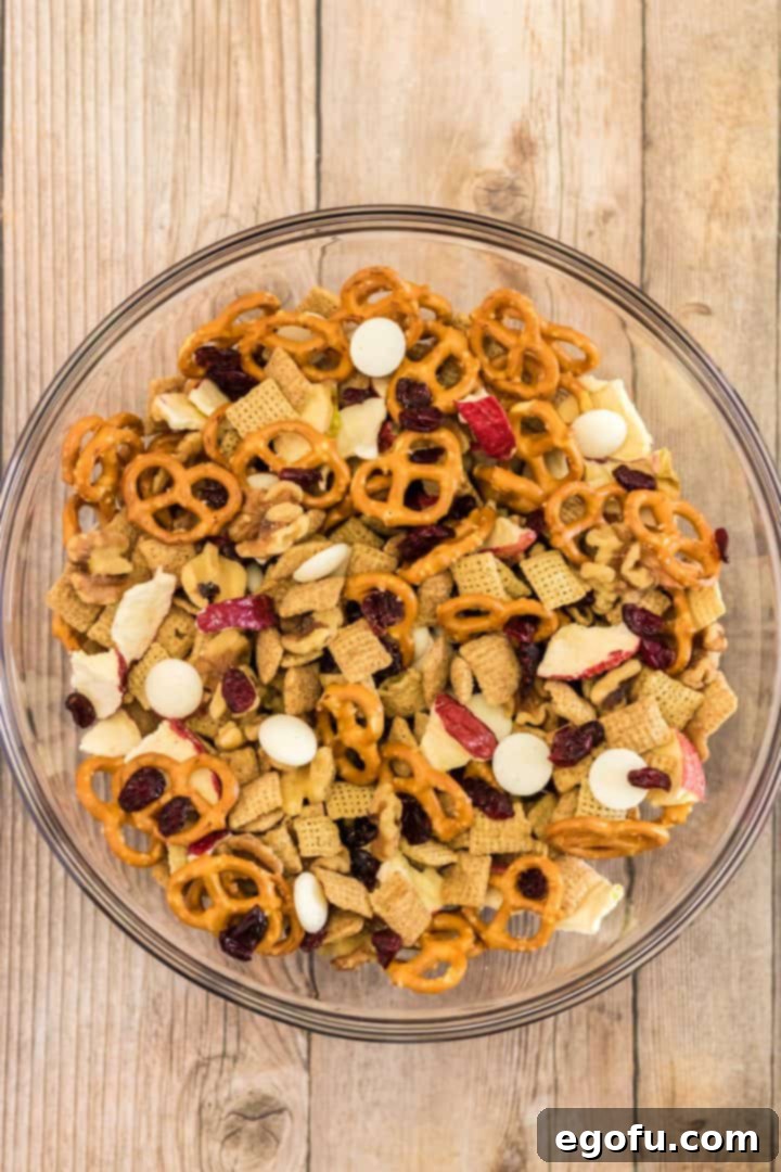 all the ingredients being mixed up in large clear bowl.