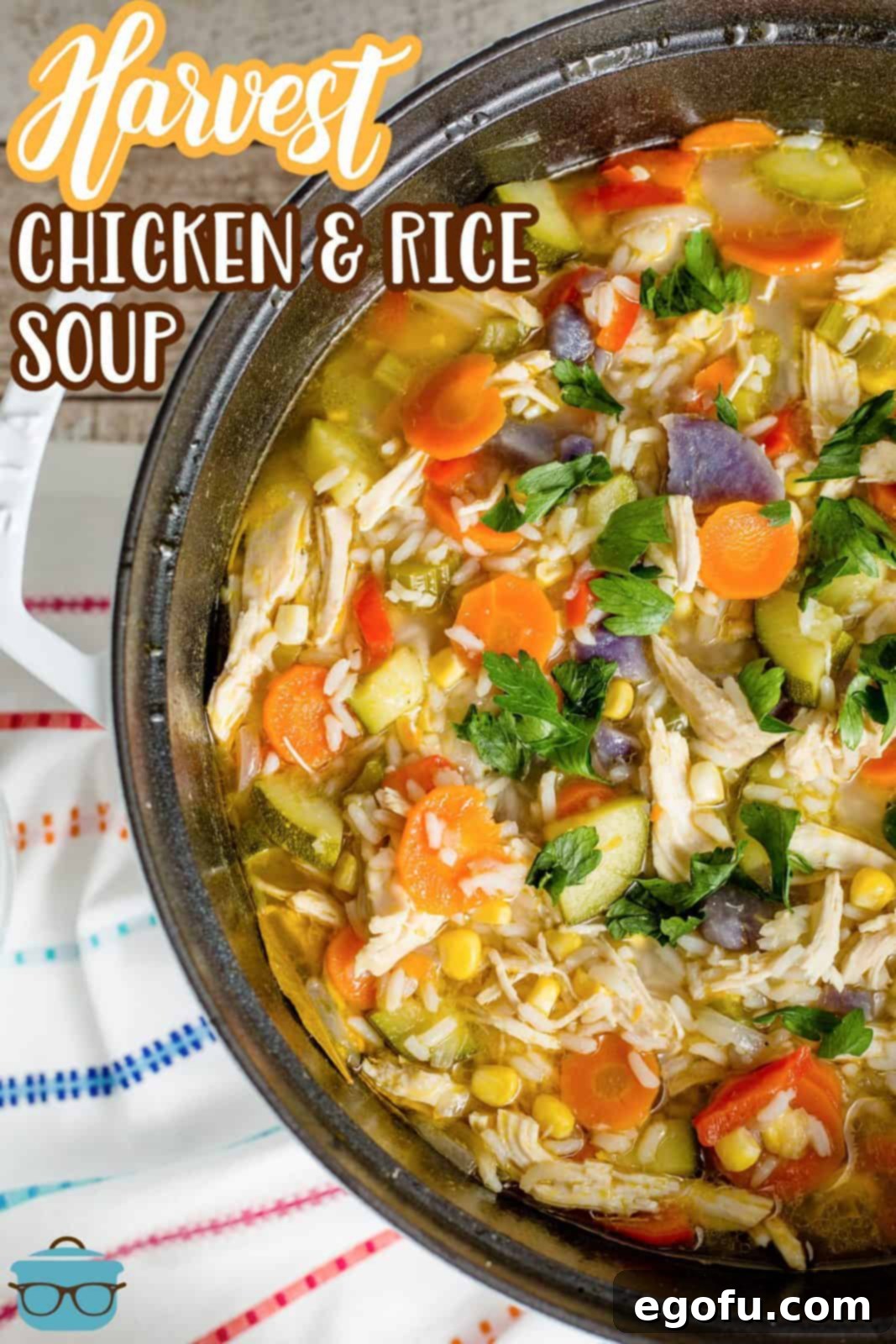 Golden Harvest Chicken and Rice Soup 3 A close-up view of the finished Harvest Chicken and Rice Soup bubbling gently in a large pot, showcasing the vibrant array of vegetables, tender chicken, and fluffy rice.