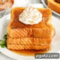Square image of Pumpkin French Toast with syrup and whipped topping.