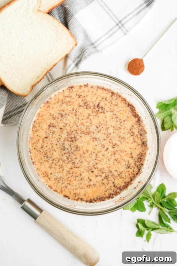 Milk, pumpkin, pumpkin spice and sugar whisked into eggs.