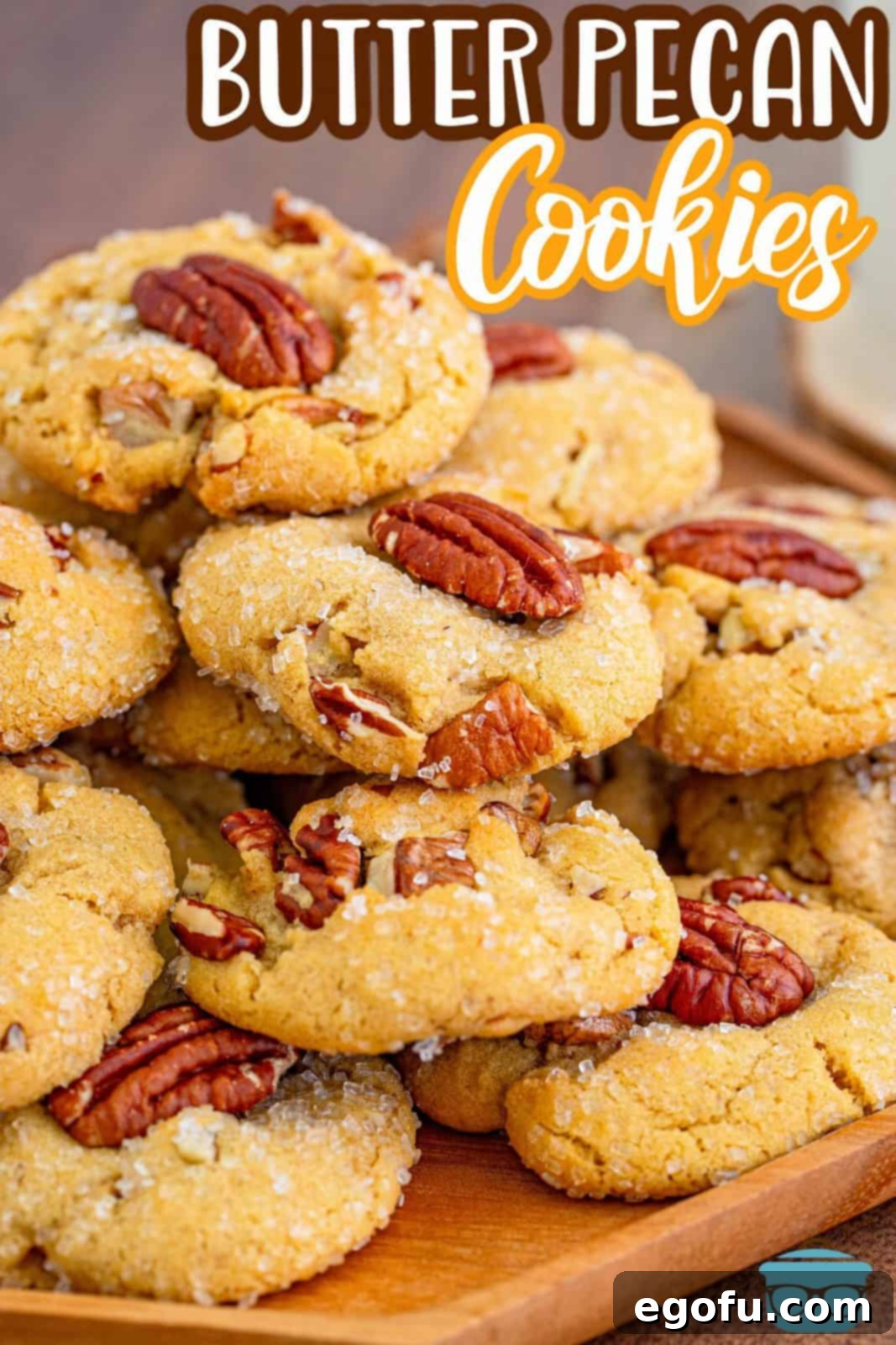 Pinterest image of close up Butter Pecan Cookies on wooden platter.