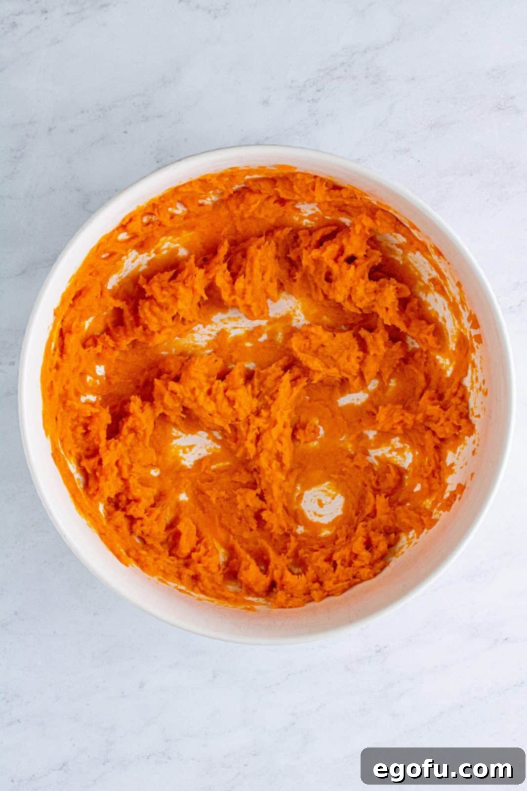 Velvet Sweet Potato Dream Pie 5 Sweet potatoes blended in bowl.