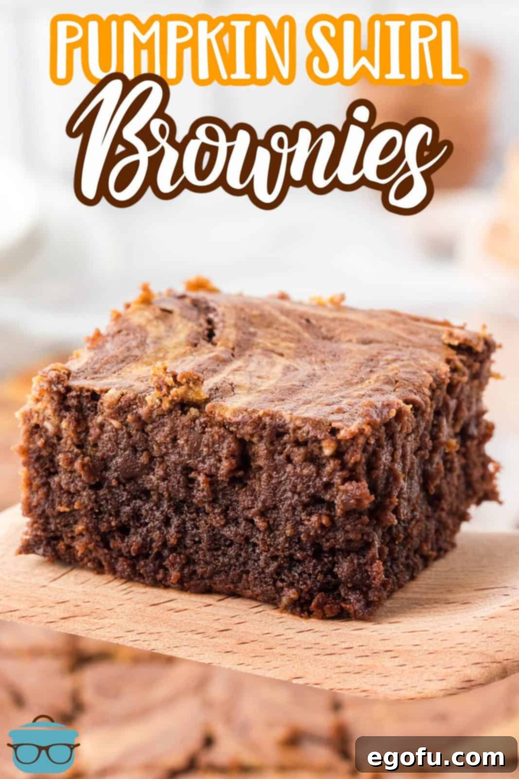 Pinterest image of a single Pumpkin Swirl Brownie on a rustic wooden server, perfect for sharing.