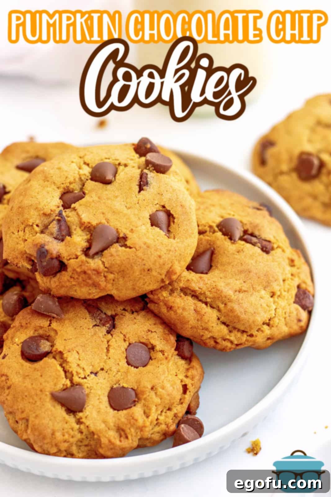 Pinterest image of side of white plate with stacked Pumpkin Chocolate Chip Cookies.