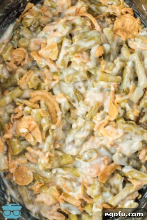 Close up of finished Crock Pot Green Bean Casserole in crock pot.