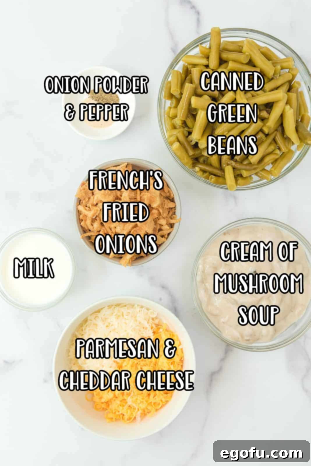 green beans, cream of mushroom soup, cheddar cheese, parmesan cheese, milk, fried onions, onion powder and pepper.