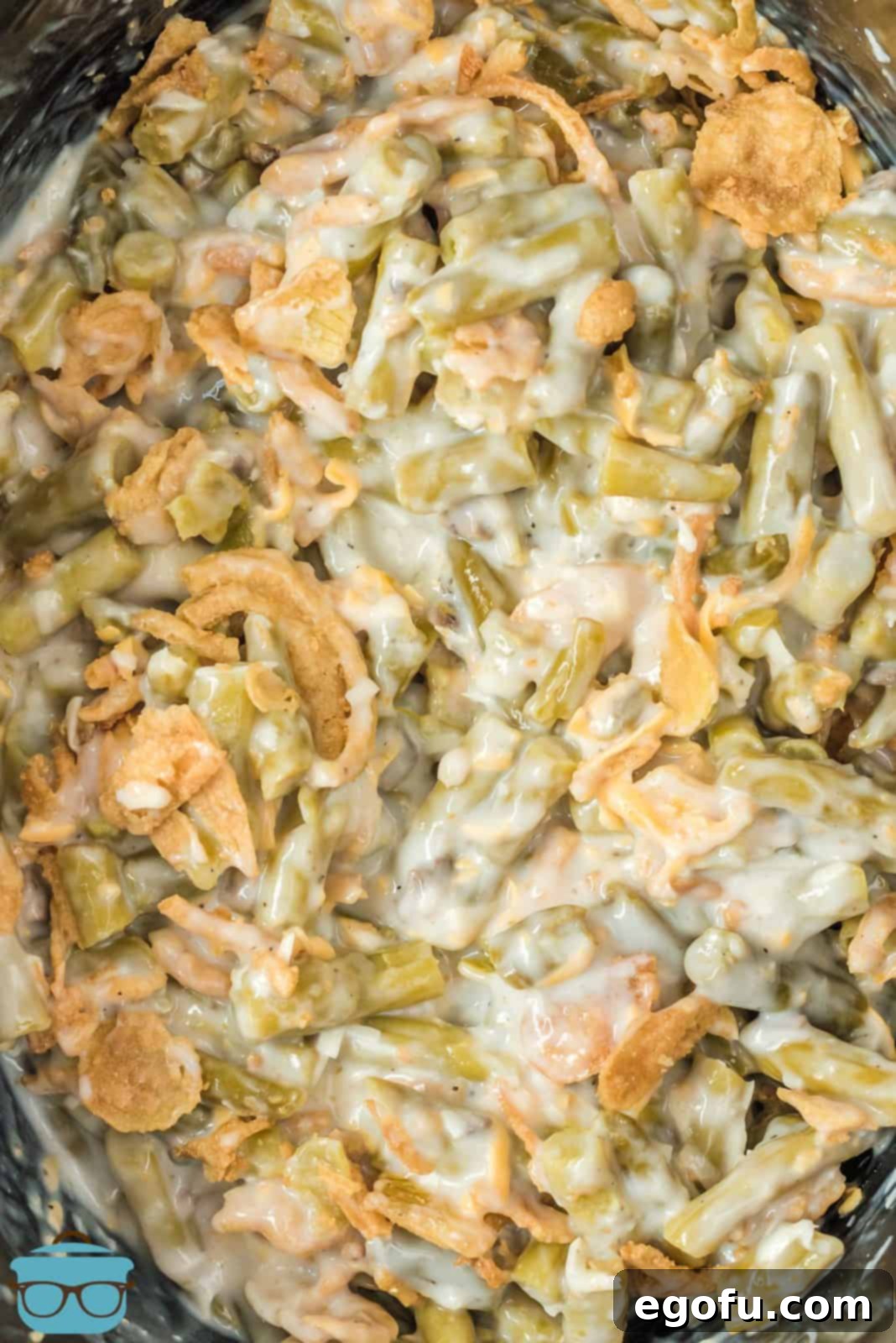Close up of finished Crock Pot Green Bean Casserole in crock pot.