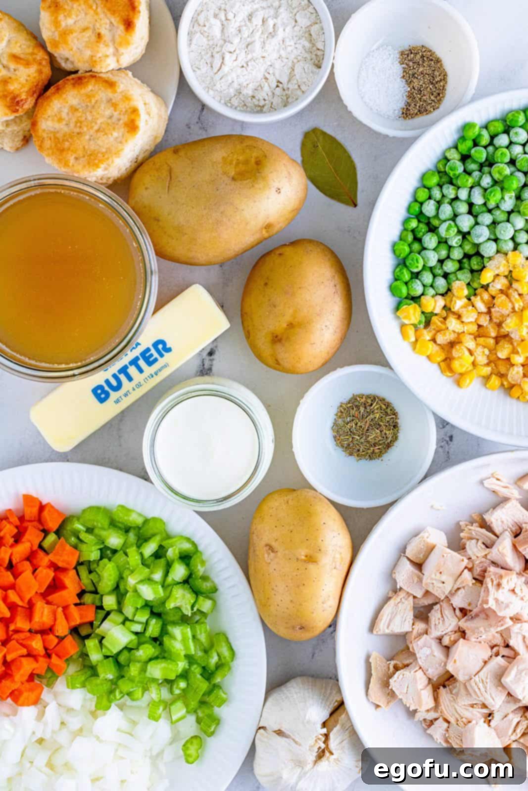 Ingredients needed: salted butter, carrot, celery, onion, garlic, all-purpose flour, chicken stock, potatoes, bay leaf, thyme, pepper, chicken, heavy cream, frozen peas and frozen corn.