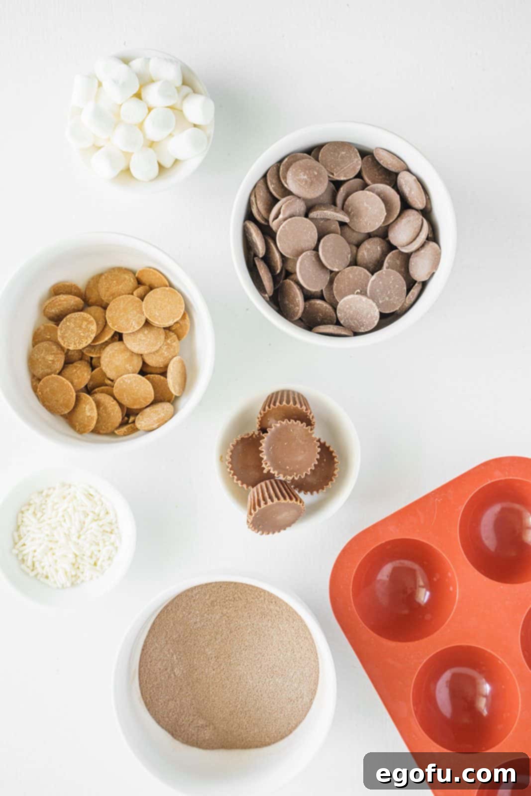 Ingredients needed: chocolate candy melts, hot cocoa, mini marshmallows, mini peanut butter cups, peanut butter candy melts and sprinkles.