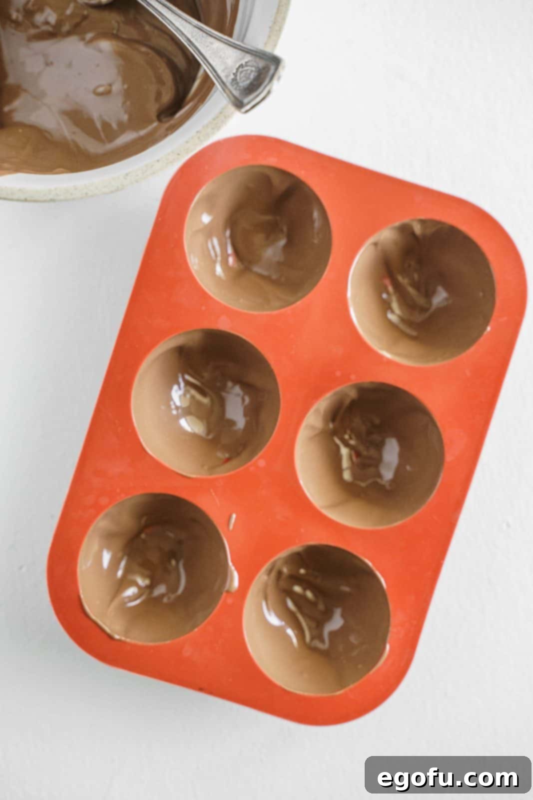 Chocolate brushed inside molds.