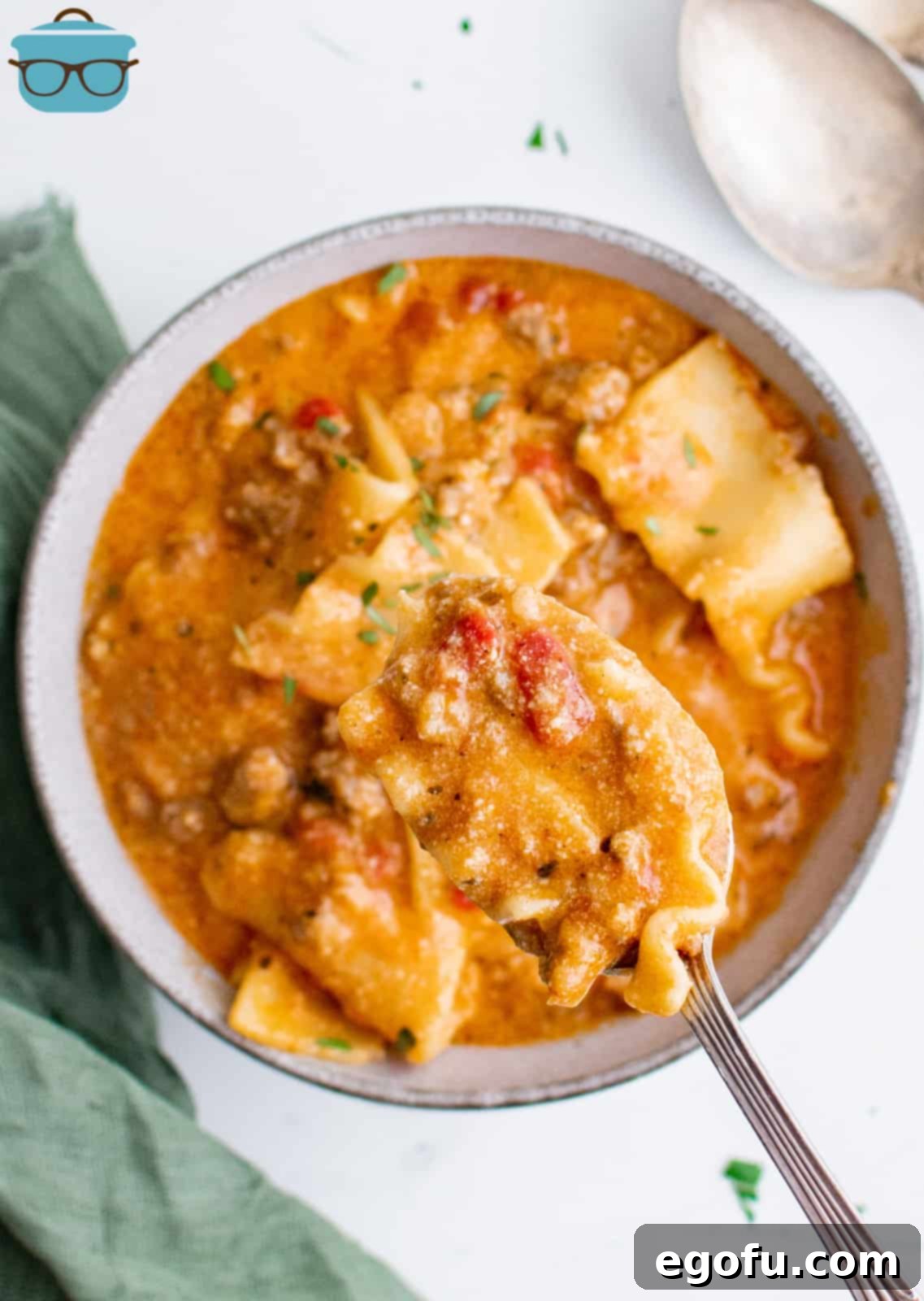 Spoon holding up a scoop of the Instant Pot Lasagna Soup.