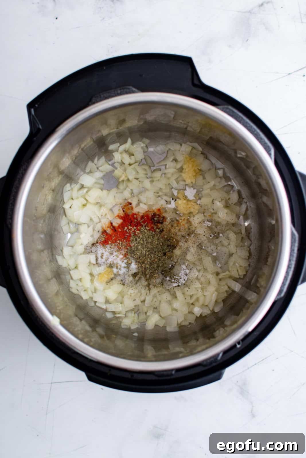 Olive oil, onion, garlic, Italian seasoning, paprika, salt and pepper added to instant pot and sauteed.