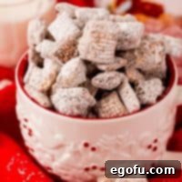 Close up square image of Nutella Puppy Chow Recipe in mug.