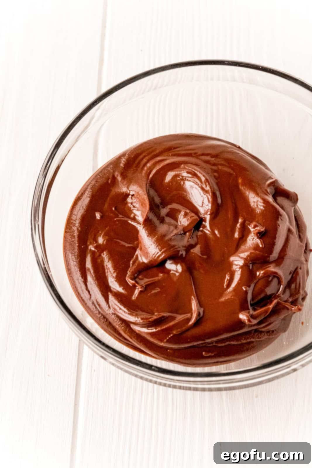 Nutella and chocolalte chips melted and stirred together in bowl.